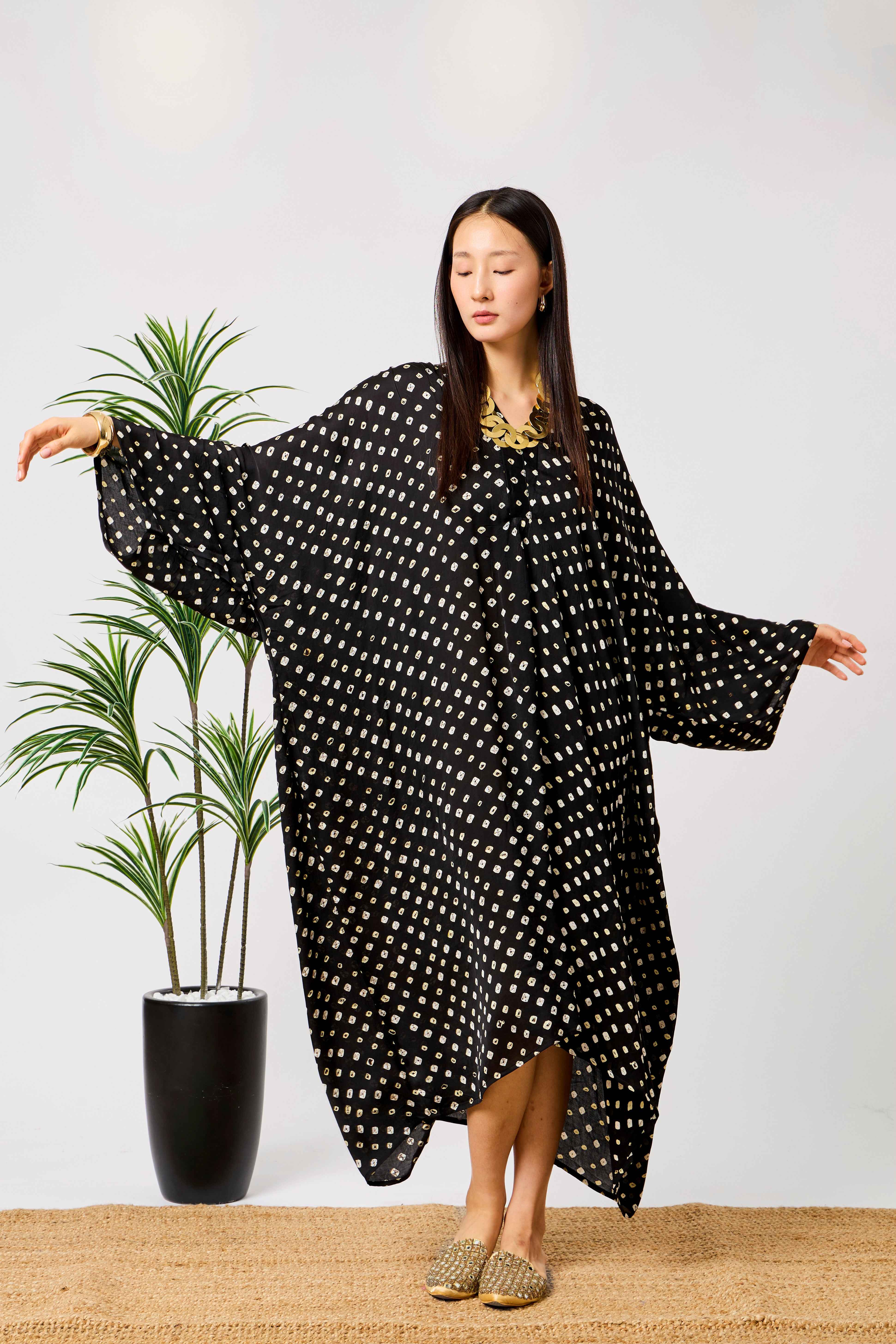 Black Modal Silk Bandhani Print Kaftan Dress for Women with Batwing Sleeves & Tassel Neckline | Noirelle
