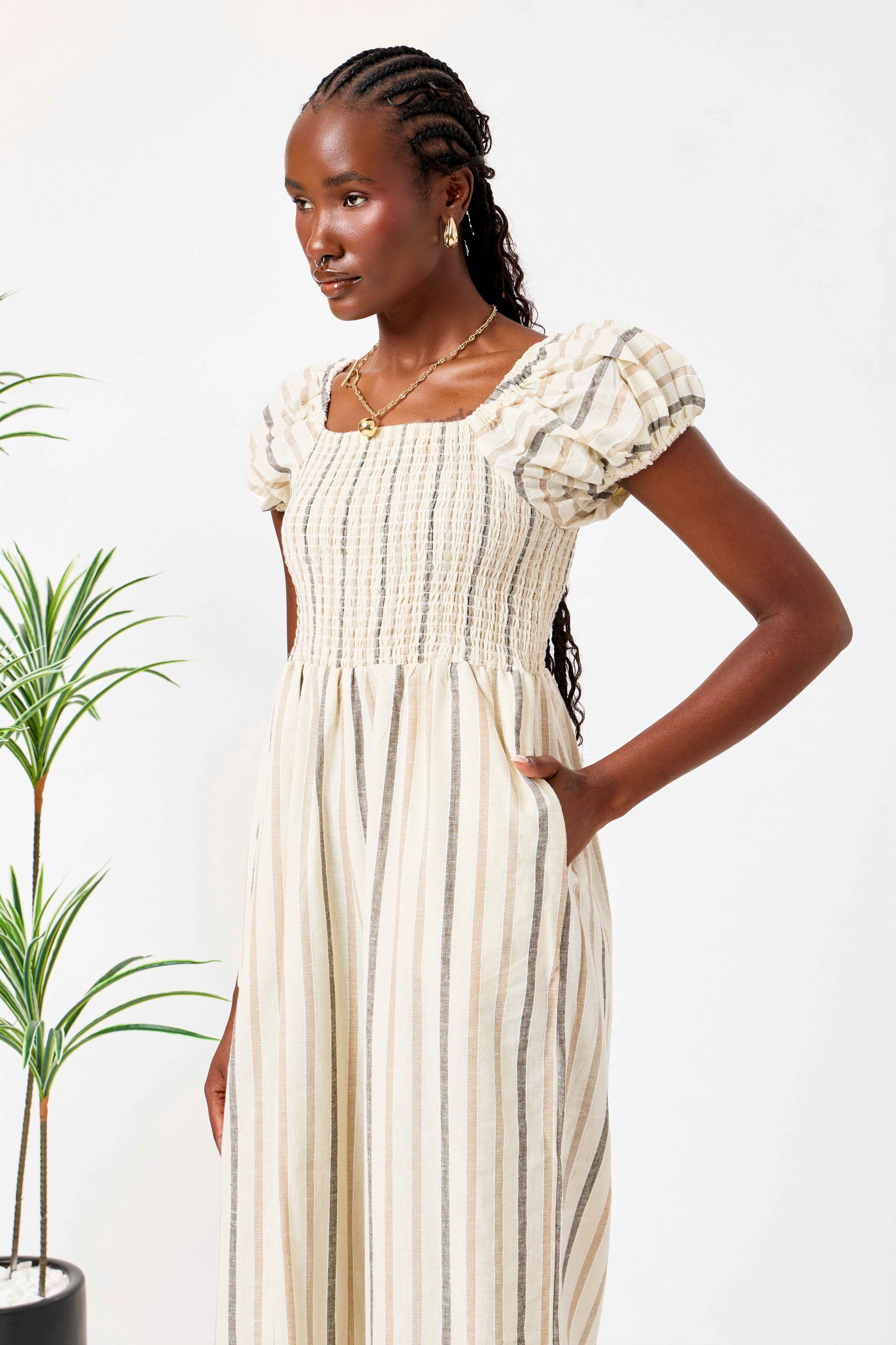 Beige Cotton Linen Blend Striped Smocked Jumpsuit for Women with Puff Sleeves & Wide-Leg Fit | Zahr