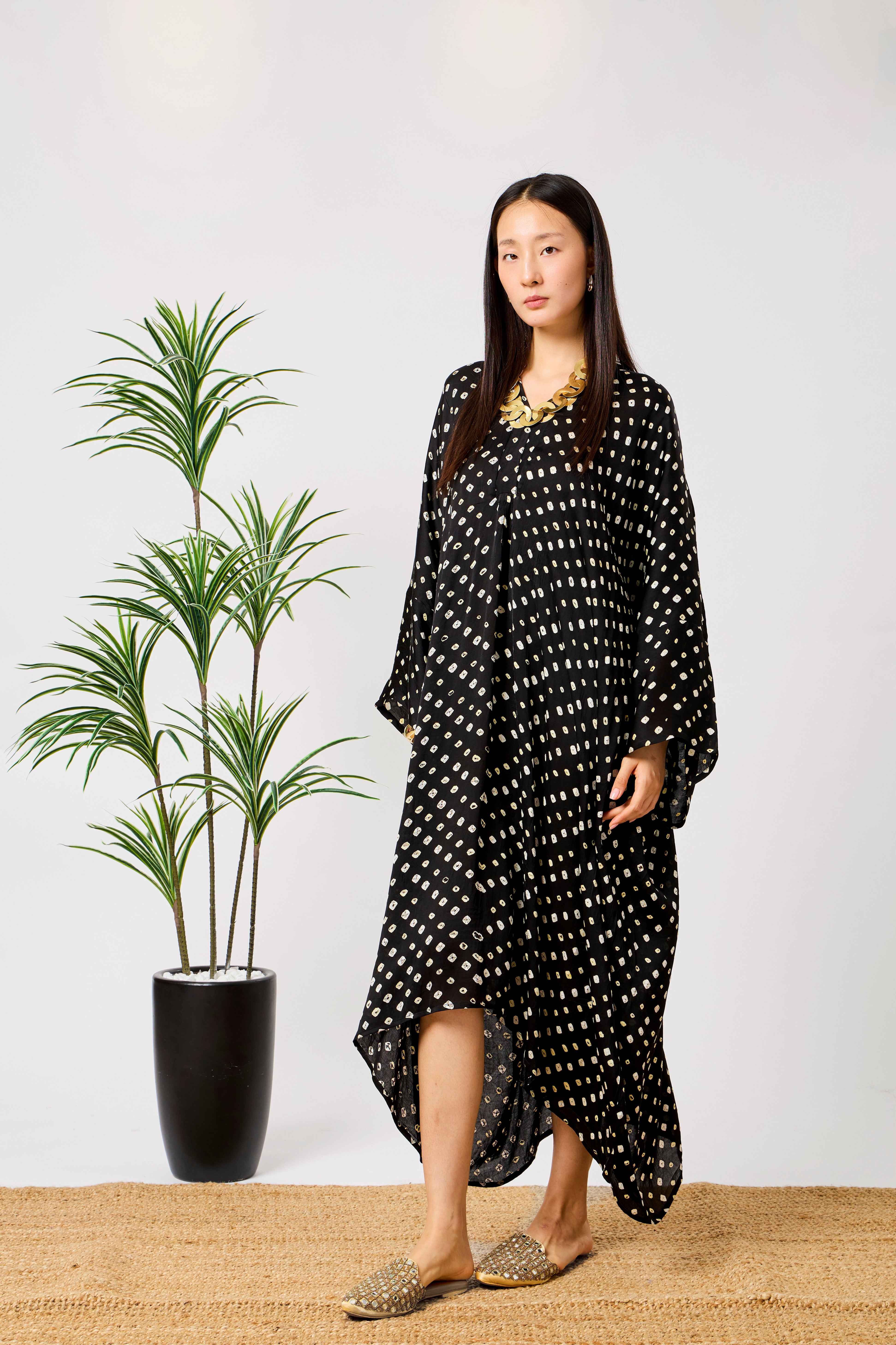 Black Modal Silk Bandhani Print Kaftan Dress for Women with Batwing Sleeves & Tassel Neckline | Noirelle