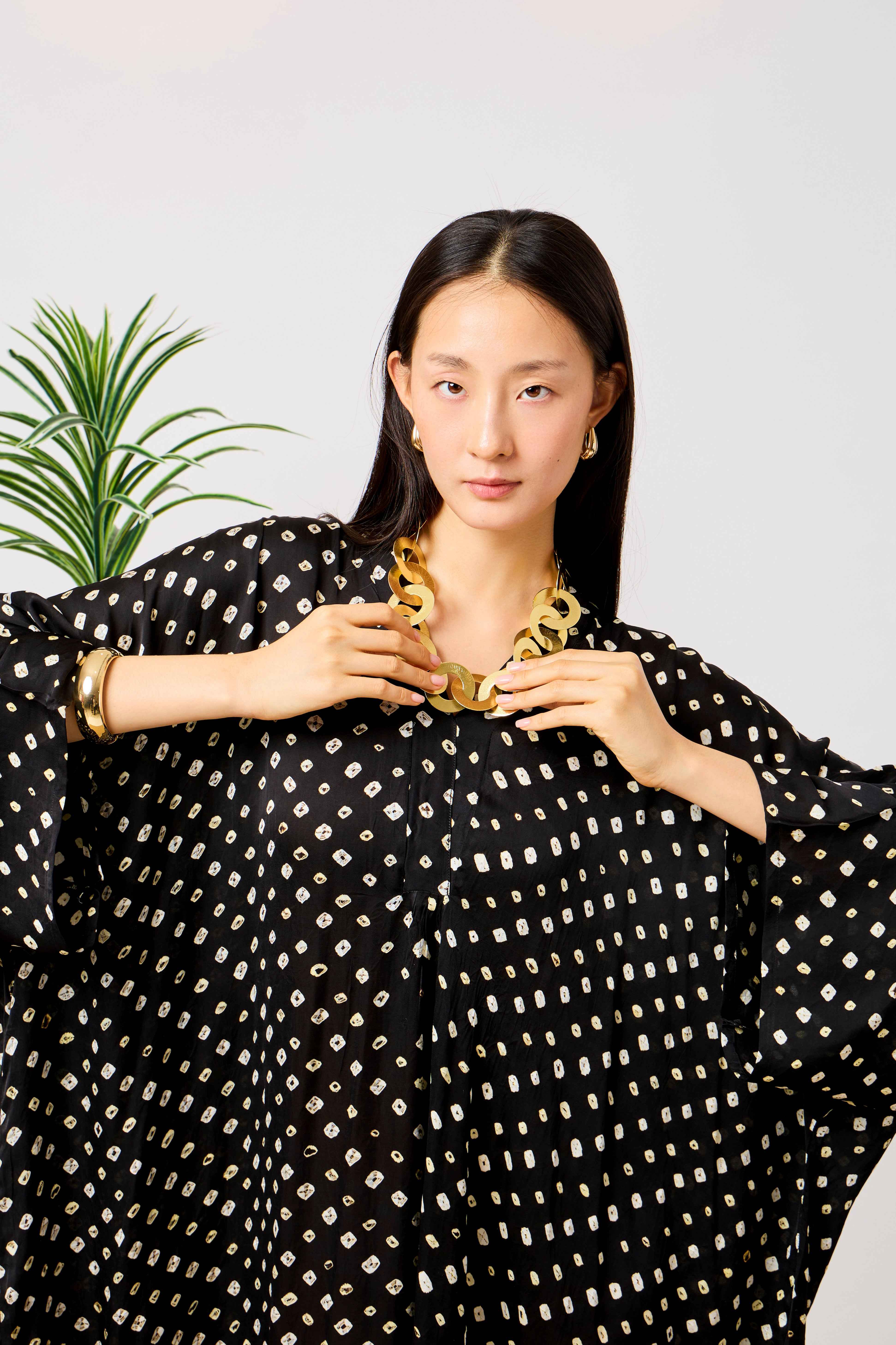 Black Modal Silk Bandhani Print Kaftan Dress for Women with Batwing Sleeves & Tassel Neckline | Noirelle